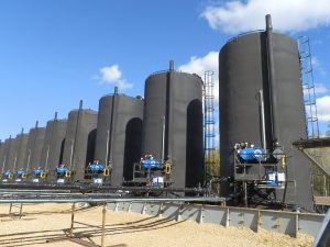 Tank pad at a wellsite in Alberta with oil storage tanks with B149 gas-fired field approval